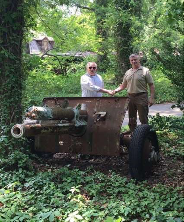 Lieutenant-Colonel Paul Carey collecting the 18pounder from Mr Glenn Gates